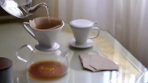 Preparing filter coffe pouring hot water Stock Footage 254905340