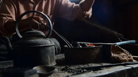 Preparing fire for melting the silver Stock Footage 71186609