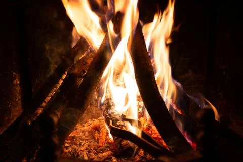 Preparing the fireplace at home. Making fire and putting the wood well with t Stock-Fotos