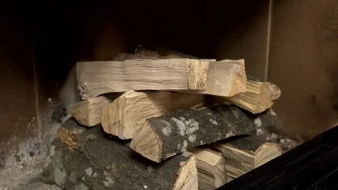 Preparing the fireplace for ignition. Stack firewood in the fireplace. Stock Footage 123230695