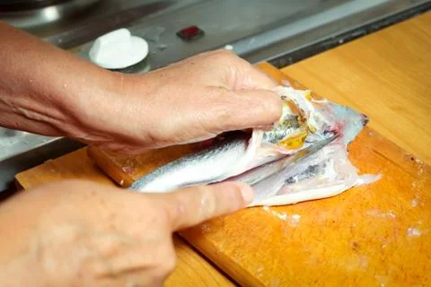 Preparing fish on board Stock Photos