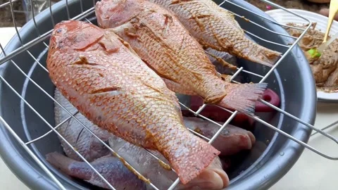 Preparing Fish for Cooking Over Stock Footage 277938681