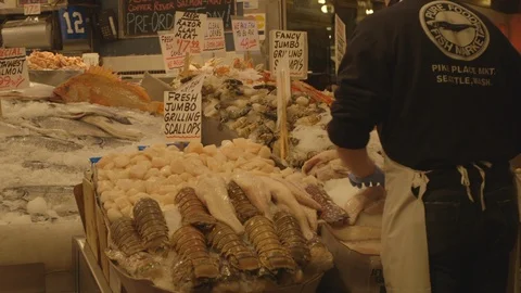 Preparing Fish Display in Pike Place Market Stock Footage 115502411