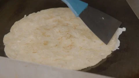 Preparing Flatbread with Two Spatulas on Griddle in Beijing Stock Footage 345922021