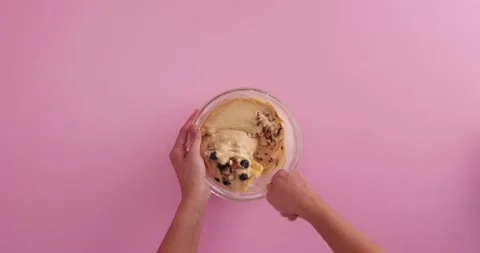 Preparing with flour, eggs, blueberries, sugar and serving blueberry blondie bro Stock Footage 133816588