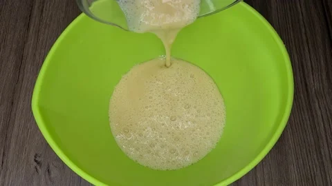 Preparing fluffy pancakes with eggs and bananas Video stock 171539318
