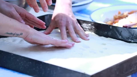 Preparing a focaccia bread with onions and red pepper Video stock 133750737