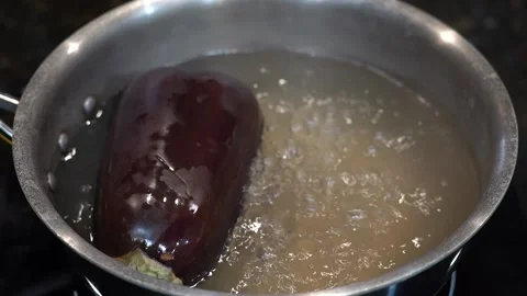 Preparing Food In Boiling Water In A Kitchen Video stock 139724112
