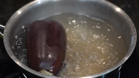 Preparing Food In Boiling Water In A Kitchen Video stock 139724123