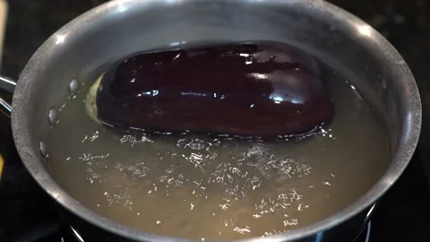 Preparing Food In Boiling Water In A Kitchen Video stock 139724156