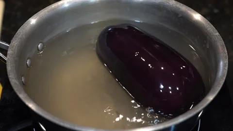 Preparing Food In Boiling Water In A Kitchen Video stock 139724162