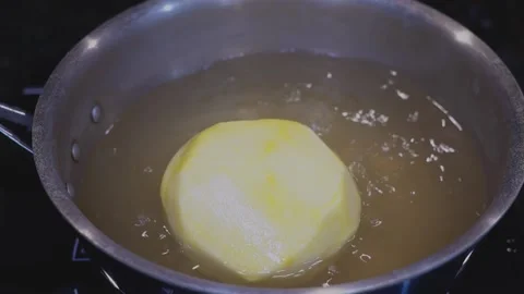 Preparing Food In Boiling Water In A Kitchen Video stock 139724377