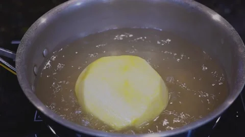 Preparing Food In Boiling Water In A Kitchen Video stock 139724387