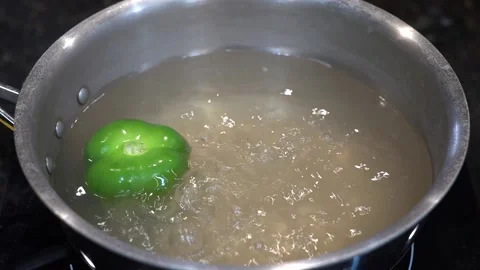 Preparing Food In Boiling Water In A Kitchen Video stock 139724826