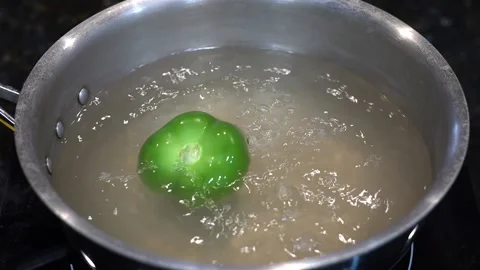 Preparing Food In Boiling Water In A Kitchen Video stock 139724827