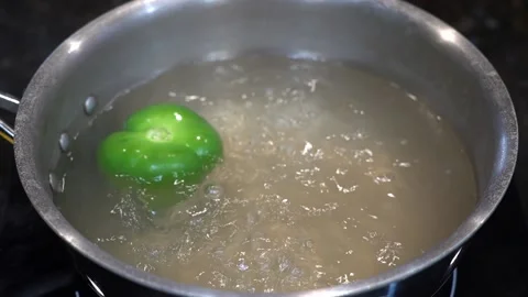 Preparing Food In Boiling Water In A Kitchen Stock Footage 139724871
