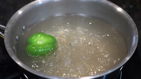 Preparing Food In Boiling Water In A Kitchen Stock Footage 139724874