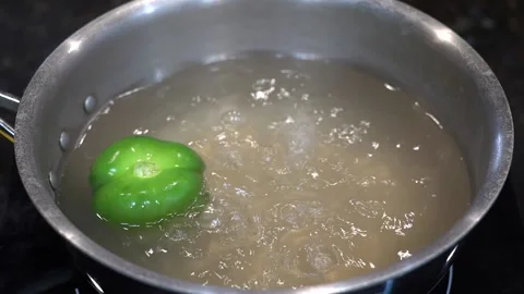 Preparing Food In Boiling Water In A Kitchen Stock Footage 139724982