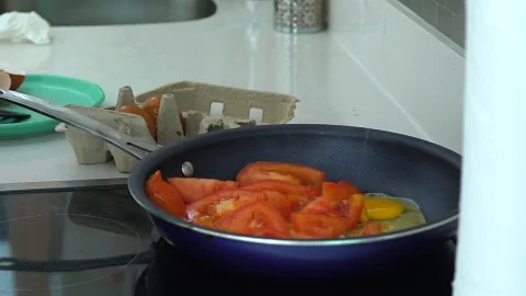 Preparing food. Break egg. fresh organic eggs falling into frying pan Stock Footage 167804938