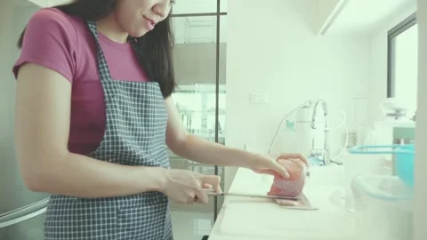 Preparing Food in a Bright Kitchen Stock Footage 313942862