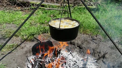 Preparing food on campfire Stock Footage 23196386