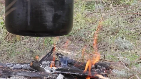 Preparing food on campfire in wild camping Stock Footage 85219232