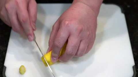 Preparing Food By Cutting On A Plastic Cutting Board In A Kitchen Video stock 139724379