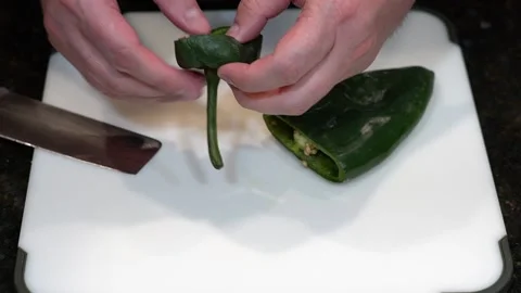 Preparing Food By Cutting On A Plastic Cutting Board In A Kitchen Video stock 139724438