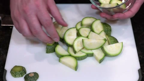 Preparing Food By Cutting On A Plastic Cutting Board In A Kitchen Video stock 139724648