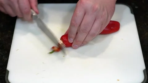 Preparing Food By Cutting On A Plastic Cutting Board In A Kitchen Stock Footage 139725269