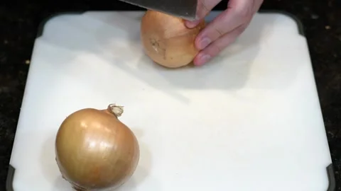 Preparing Food By Cutting On A Plastic Cutting Board In A Kitchen Stock Footage 139725307