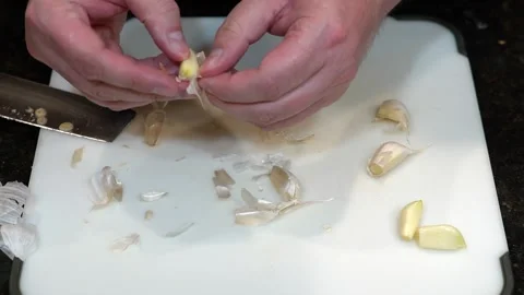 Preparing Food By Cutting On A Plastic Cutting Board In A Kitchen Stock Footage 139725320