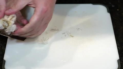 Preparing Food By Cutting On A Plastic Cutting Board In A Kitchen Stock Footage 139725321