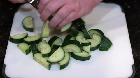 Preparing Food By Cutting On A Plastic Cutting Board In A Kitchen Stock Footage 139769580