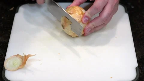 Preparing Food By Cutting On A Plastic Cutting Board In A Kitchen Stock Footage 139769642