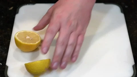 Preparing Food By Cutting On A Plastic Cutting Board In A Kitchen Video stock 139769669