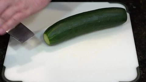 Preparing Food By Cutting On A Plastic Cutting Board In A Kitchen Stock Footage 139769723