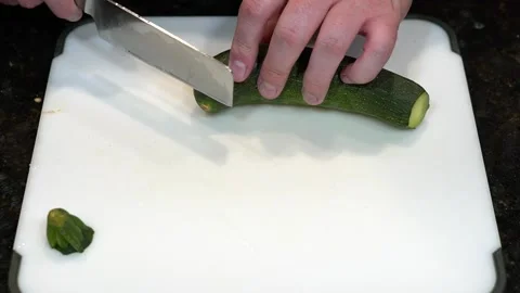 Preparing Food By Cutting On A Plastic Cutting Board In A Kitchen Stock Footage 139769949