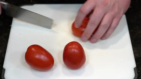 Preparing Food By Cutting On A Plastic Cutting Board In A Kitchen Stock Footage 139770037