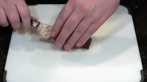 Preparing Food By Cutting On A Plastic Cutting Board In A Kitchen Stock Footage 139770049