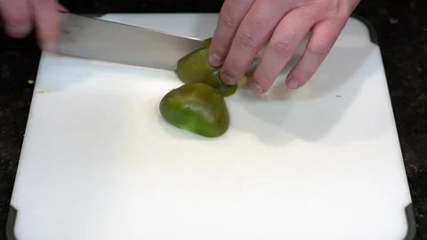 Preparing Food By Cutting On A Plastic Cutting Board In A Kitchen Stock Footage 139770111