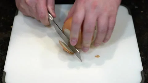 Preparing Food By Cutting On A Plastic Cutting Board In A Kitchen Stock Footage 139770155