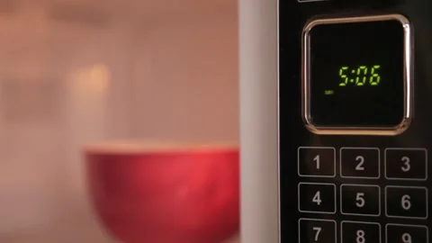 Preparing a food in the microwave Stock Footage 158262599