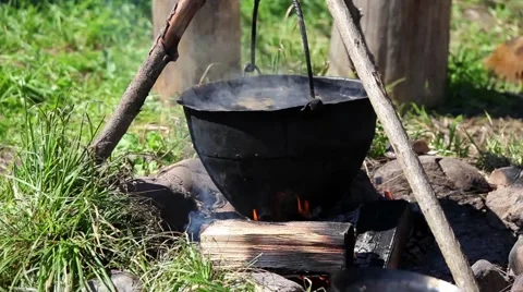 Preparing food in pot over the fire Stock Footage 53222793