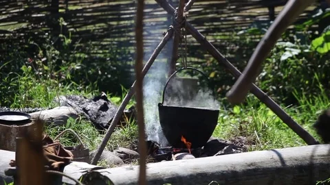 Preparing food in pot over the fire Stock Footage 81062776