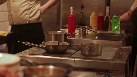 The preparing of food in a restaurant kitchen. Kitchen, restaurant, cooking Stock Footage 81375564