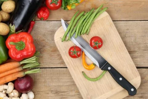 Preparing food smiling vegetables face on cutting board Stock Photos