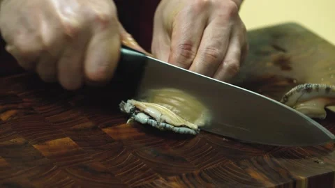 Preparing Fresh Abalone on Wooden Cutting Board Close Up Stock Footage 335733032