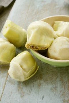 Preparing fresh artichokes Stock Photos