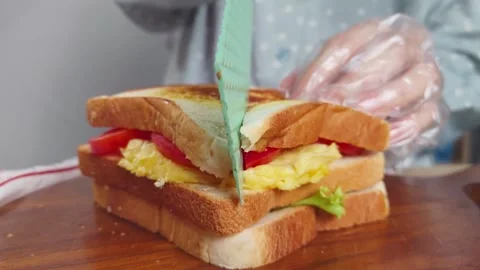 Preparing a Fresh Breakfast Sandwich Stock Footage 290105841